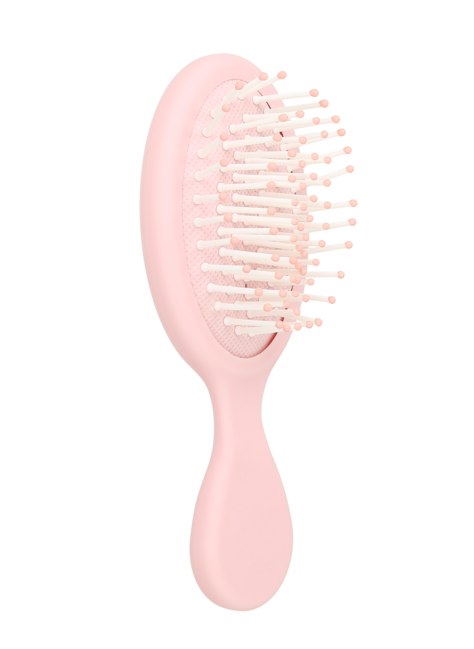 Cepillo de pelo portátil de color rosa.