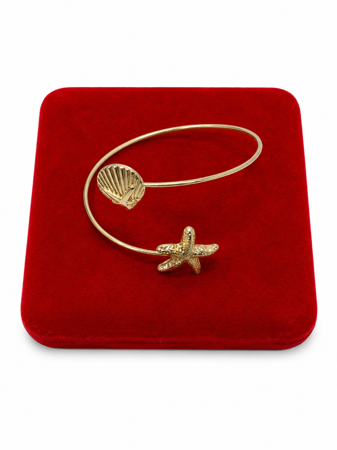 Pulsera Abierta con Diseño de Estrella de Mar y Concha Marina Color Dorado.