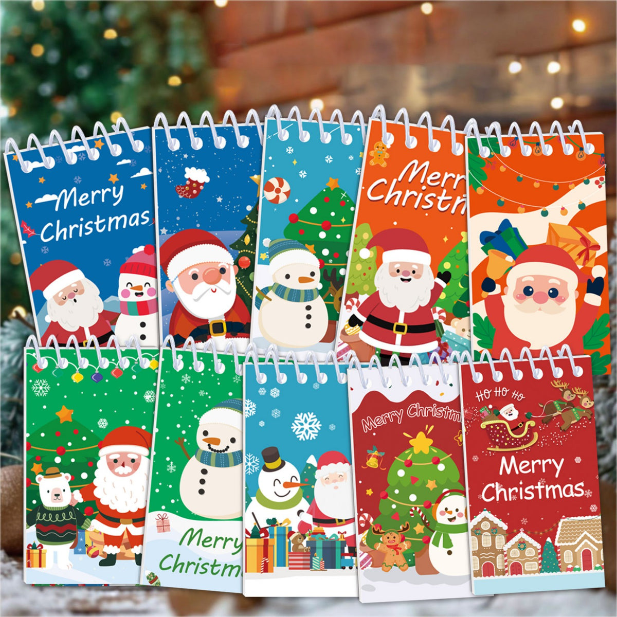 Set de 12 libretas navideñas con espiral y diseños variados.