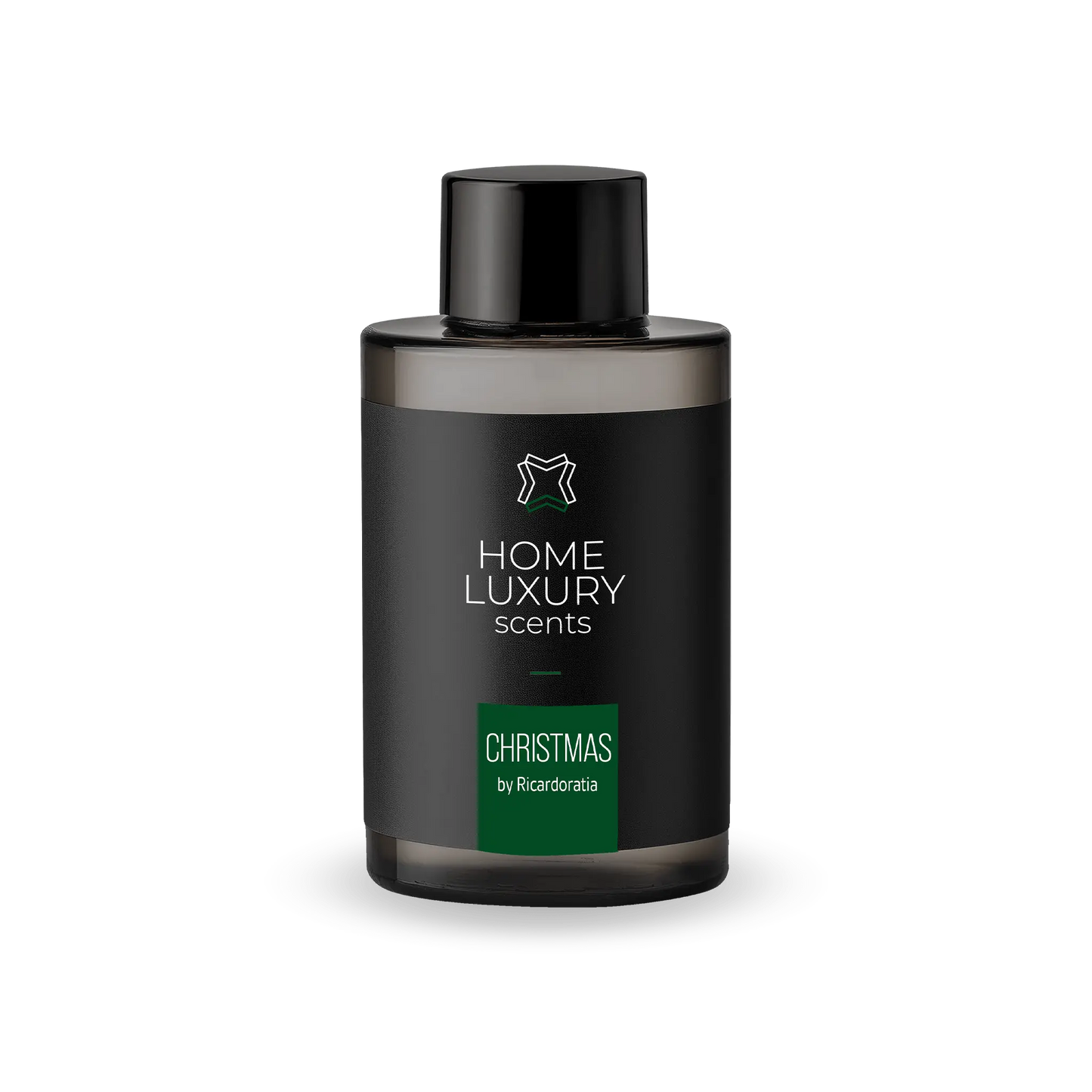 Aromatizante de ambiente Christmas en una botella negra de 100ml, esta fragancia combina notas florales con frutas dulces y un toque de canela.