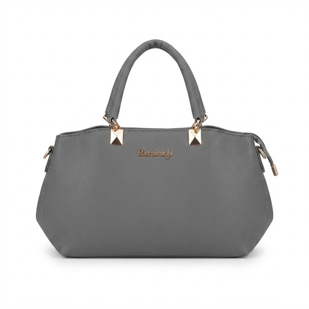 Bolso de mano gris que cuenta con elegantes detalles dorados y una textura distintiva.