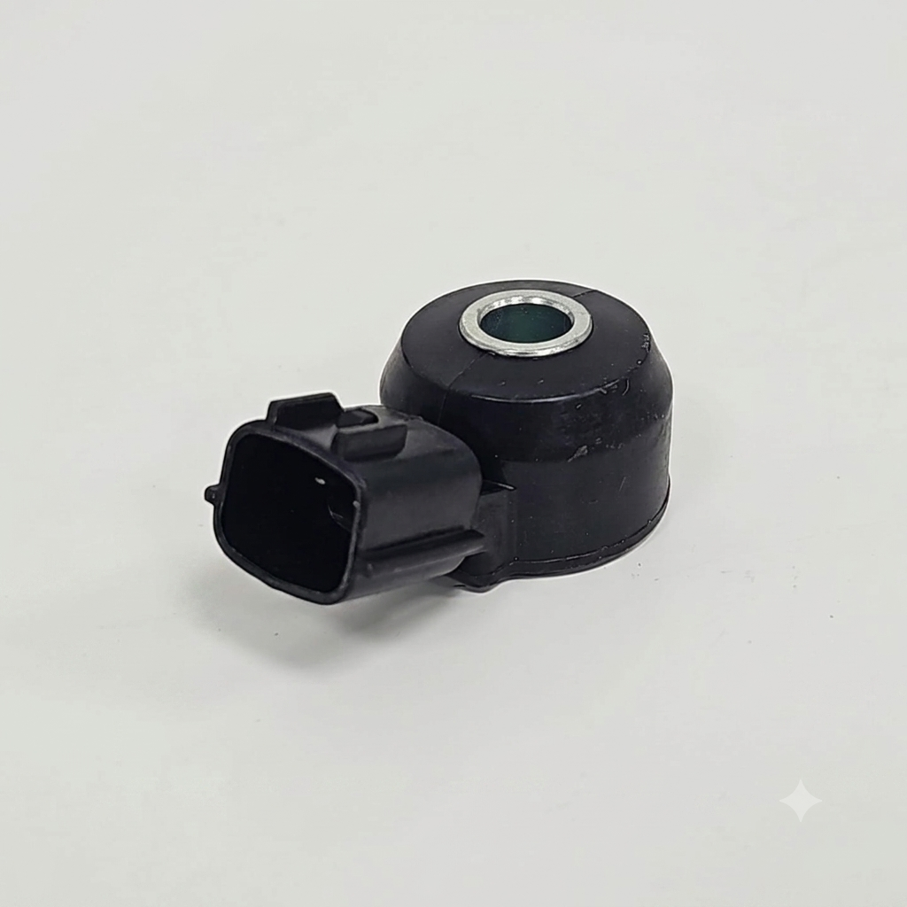 Sensor de detonación o knock sensor, compatible con varios vehículos Nissan de los años 1999 a 2004.