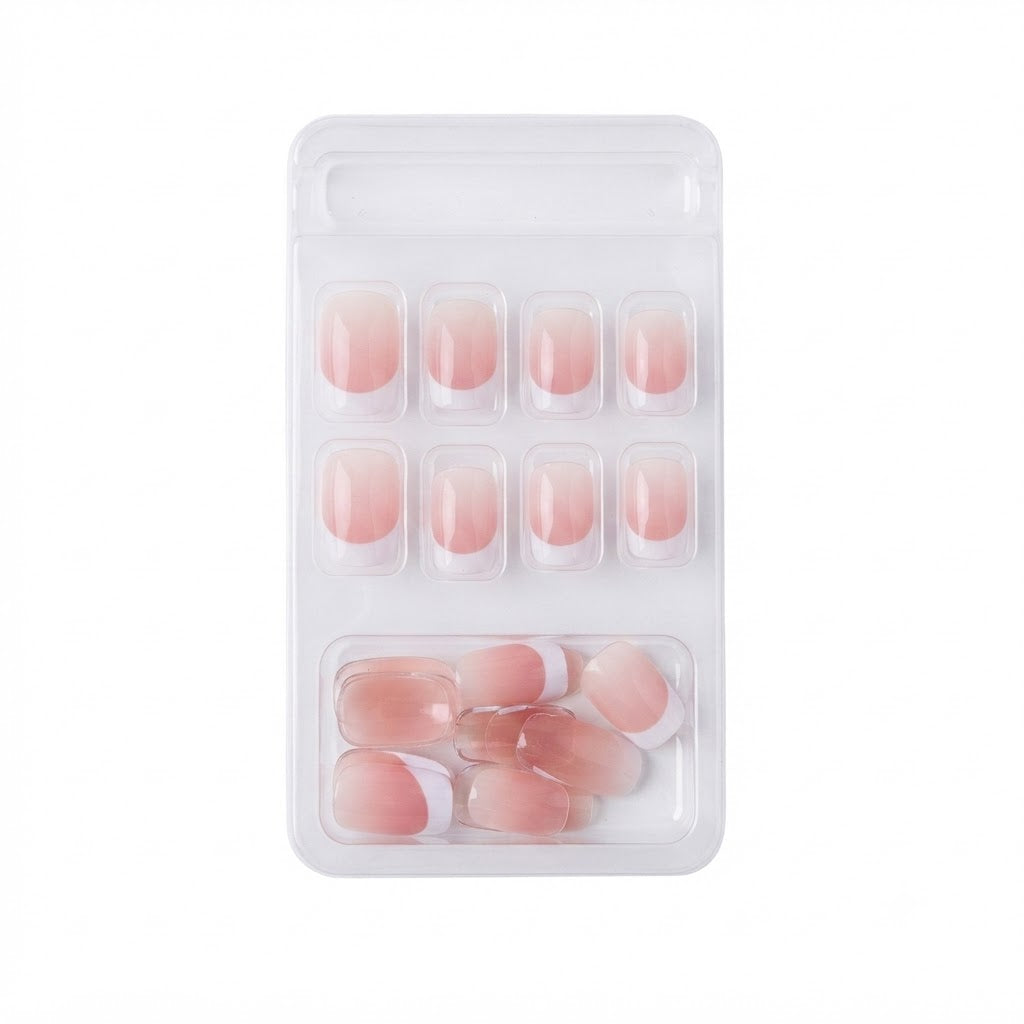Kit 24 piezas de uñas postizas estilo francés con un diseño de degradado rosa nude.