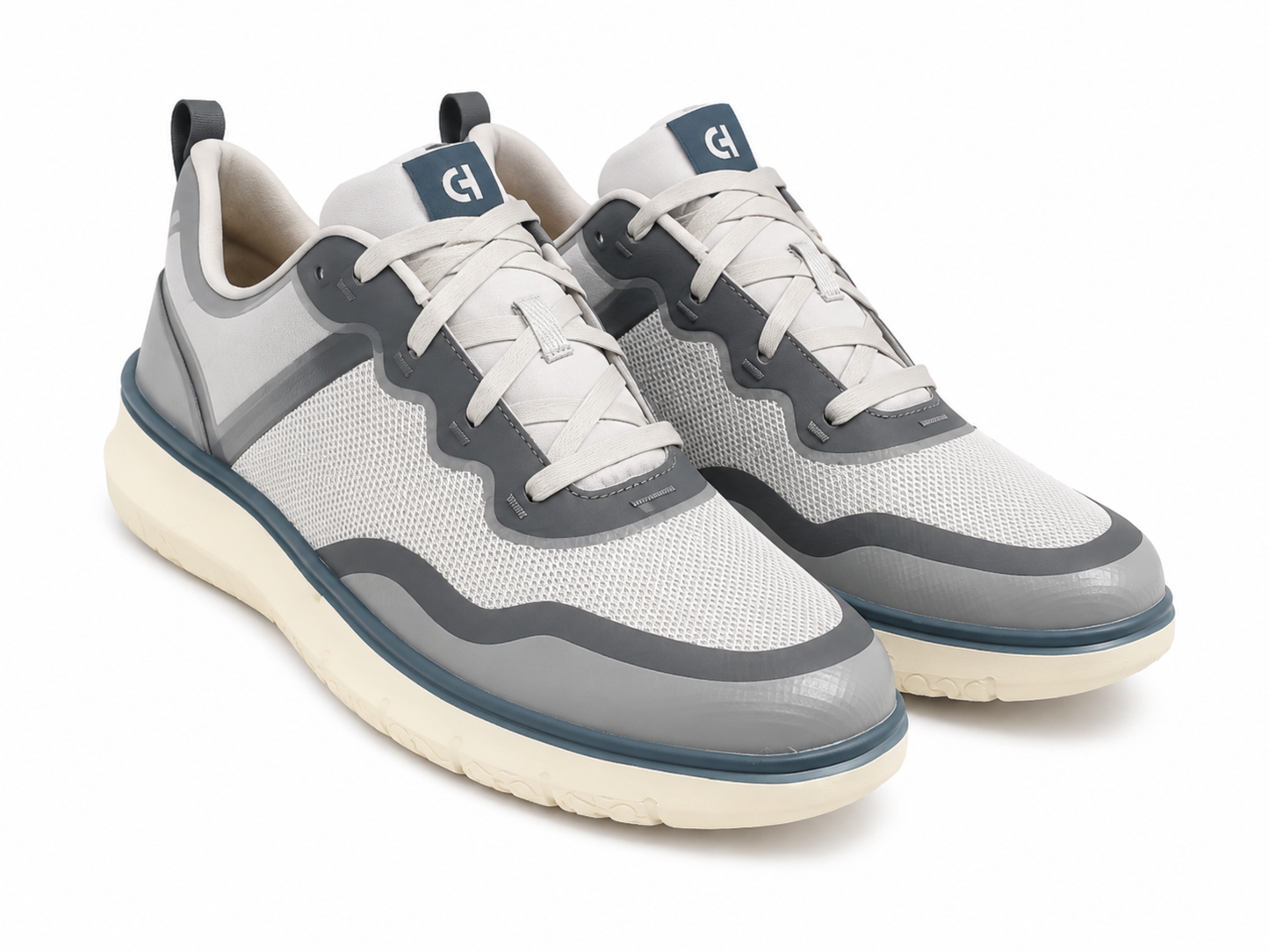 Zapatos deportivos gris y blanco con paneles de malla y suela acolchada, talla 8.5.