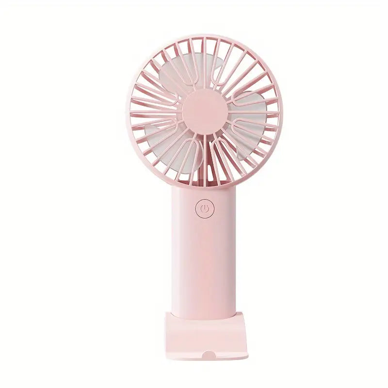 Ventilador de mano en color rosa cuenta con una batería recargable por USB y tres niveles de velocidad ajustables.
