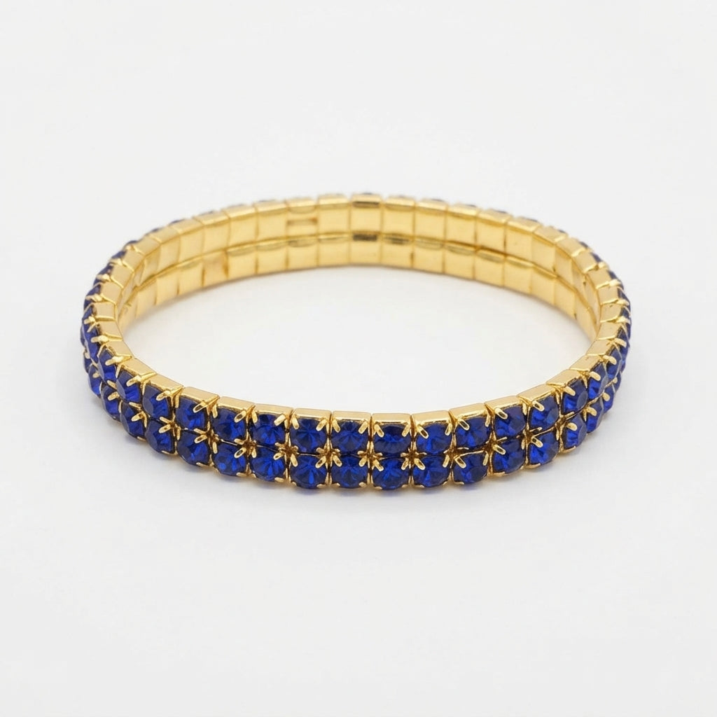 Pulsera Elástica con Cristales Azules y Color Dorado.