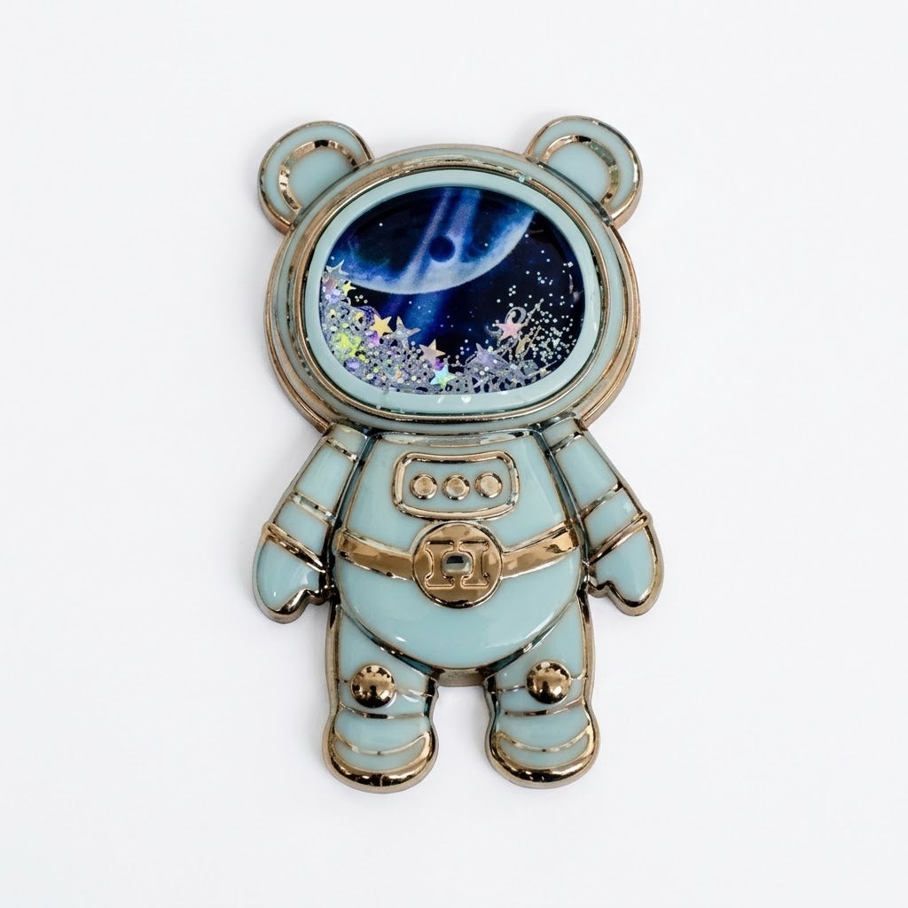 Soporte para celular de diseño astronauta con arena movediza y estrellas brillantes.