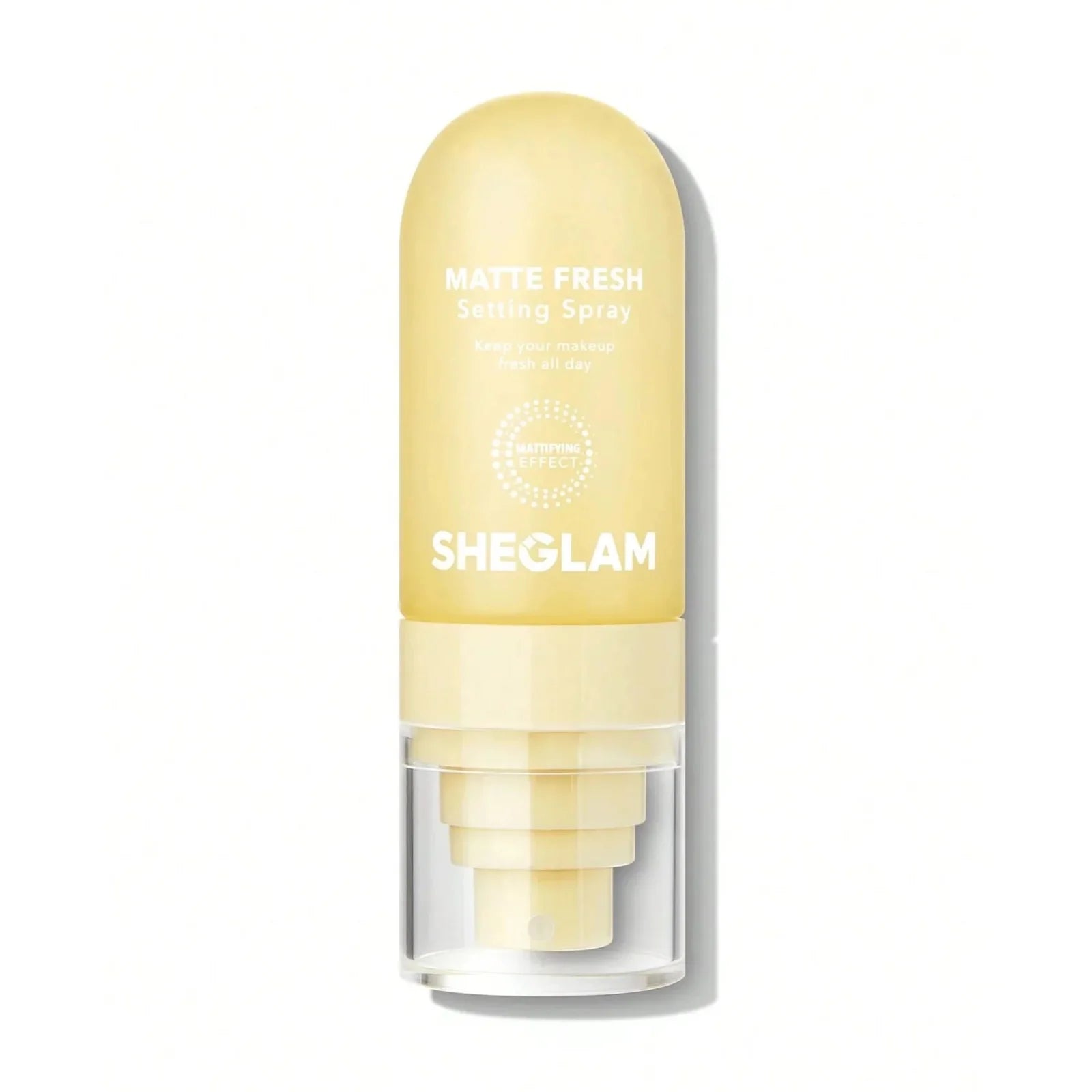 Spray fijador de maquillaje en tono amarillo/crema.