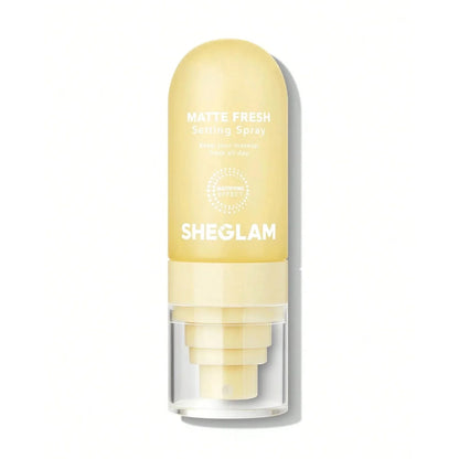 Spray fijador de maquillaje en tono amarillo/crema.