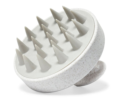 Cepillo masajeador de cuero cabelludo cuenta con cerdas suaves de silicona diseñadas para exfoliar y estimular la circulación.