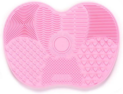 Alfombrilla de limpieza de brochas de maquillaje de silicona rosa.
