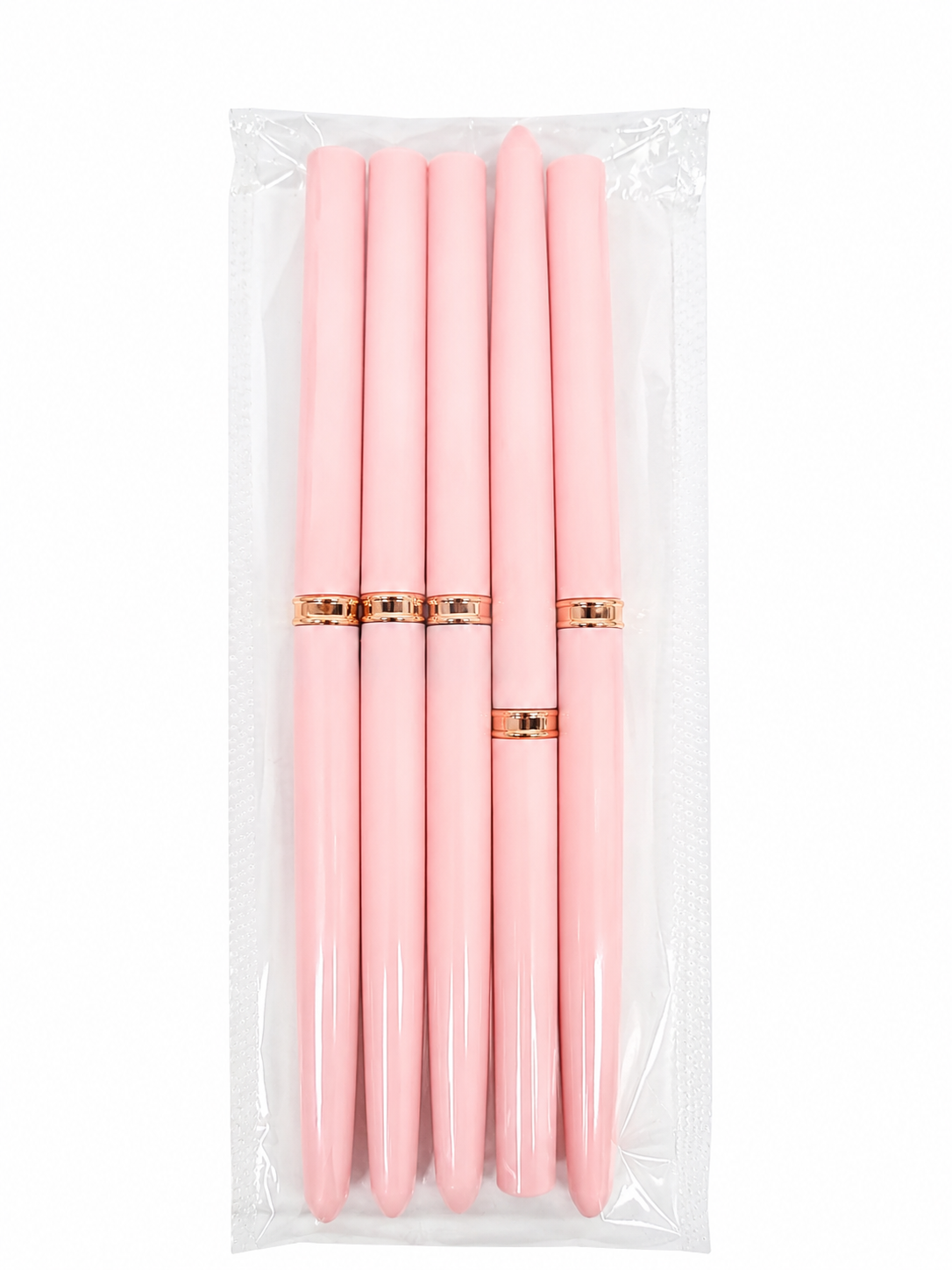 Set de 5 bolígrafos rosados con detalles dorados.