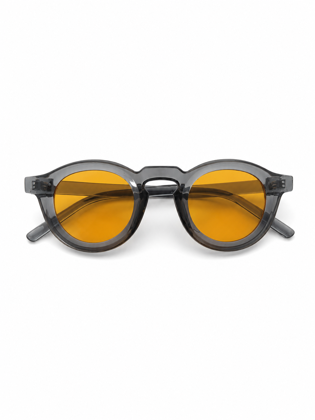Gafas de Sol Redondas con Lentes Amarillas y Montura Translúcida.