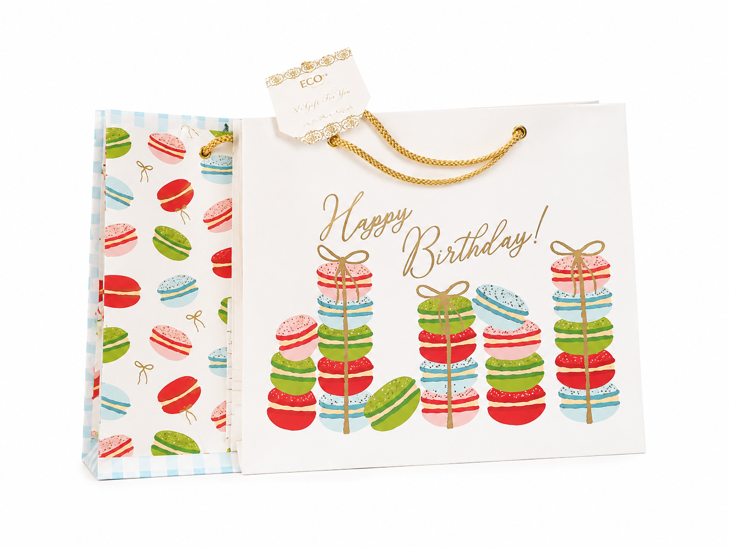 Bolsa de regalo para cumpleaños con diseño de macarons multicolor y asas doradas.