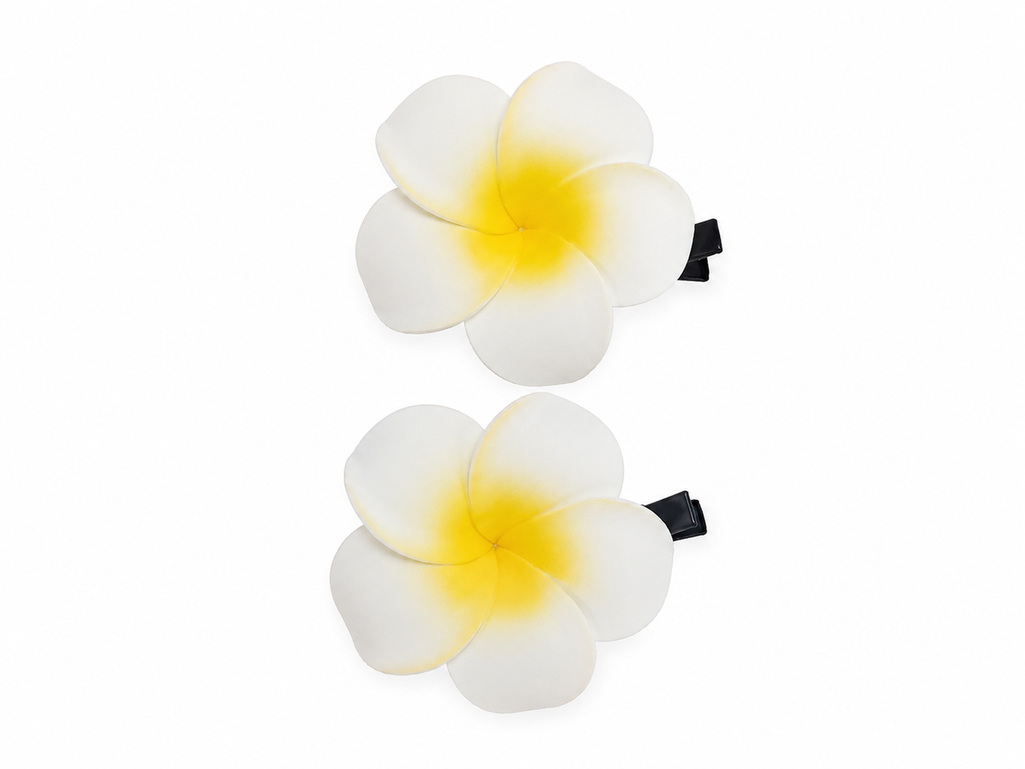 Set de pinzas para el cabello con diseño de flor tropical blanca y centro amarillo.