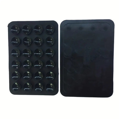 Soporte de teléfono de silicona negra con múltiples ventosas.