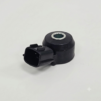 Sensor de detonación o knock sensor, compatible con varios vehículos Nissan de los años 1999 a 2004.