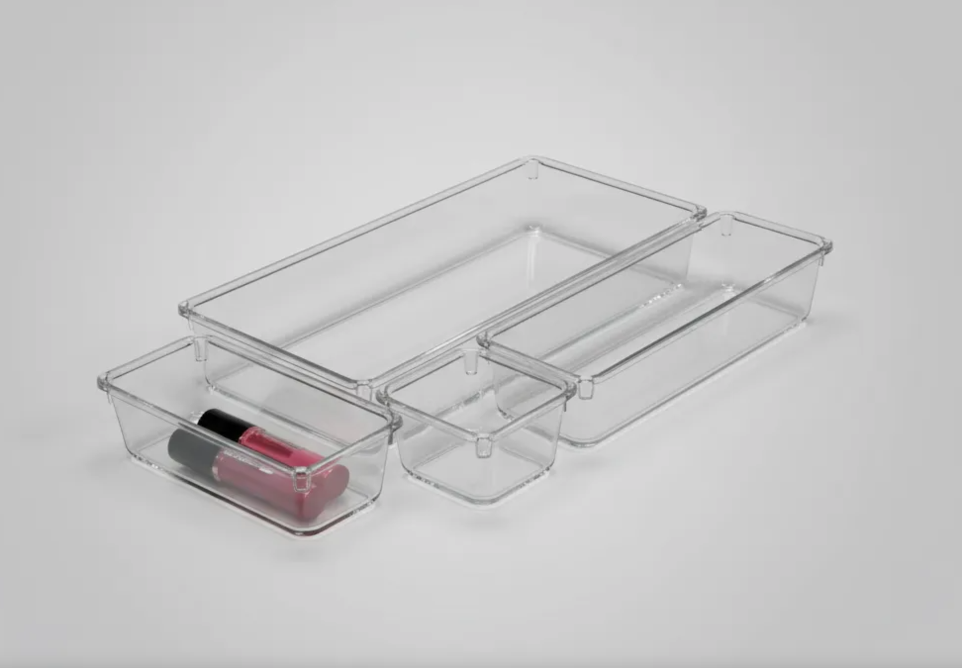 Set organizador de cajones de acrílico transparente multiusos con compartimentos modulares.