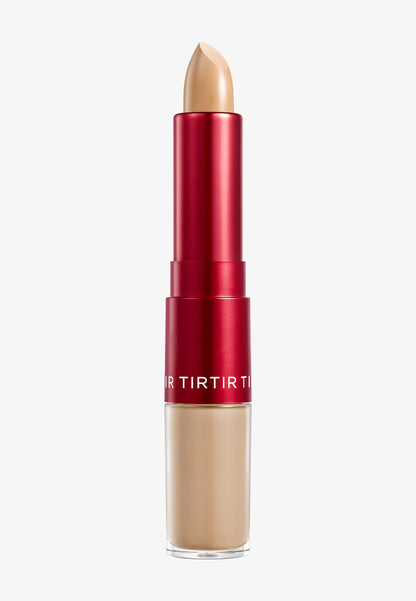 Corrector de dos extremos en un tono beige con un diseño cilíndrico rojo.