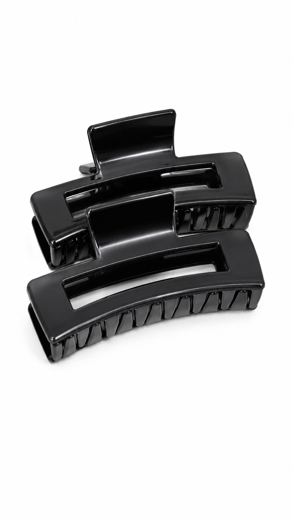 Set de pinzas grandes negras para el cabello con diseño rectangular.