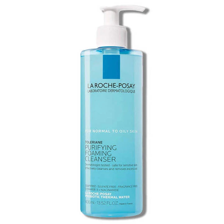 Limpiador Facial Espumoso Purificante, presentado en una botella azul de 400 ml.