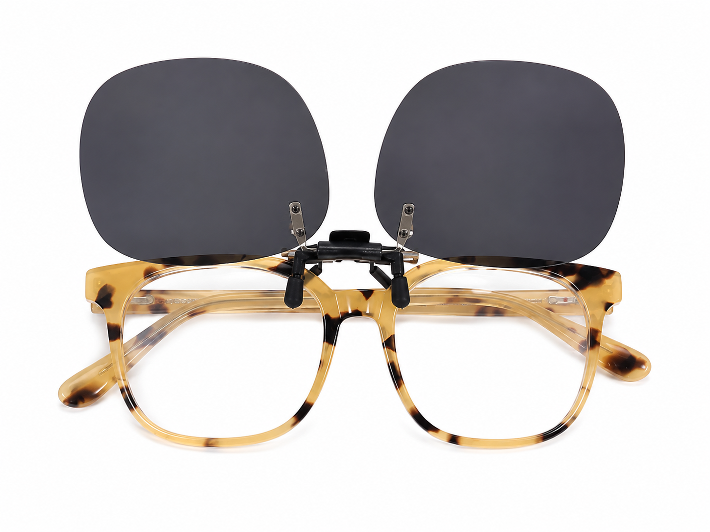 Gafas con lentes transparentes y clip magnético de lentes oscuros color carey.