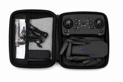 Drone plegable con control remoto, estuche de transporte y accesorios.