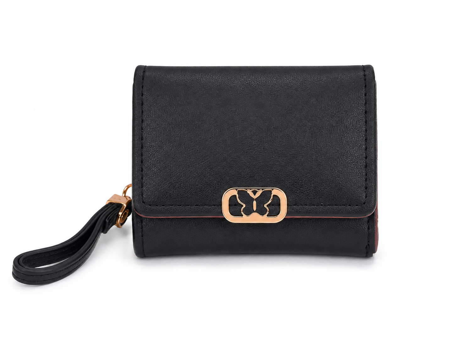 Cartera compacta negra con broche decorativo dorado y correa de muñeca.