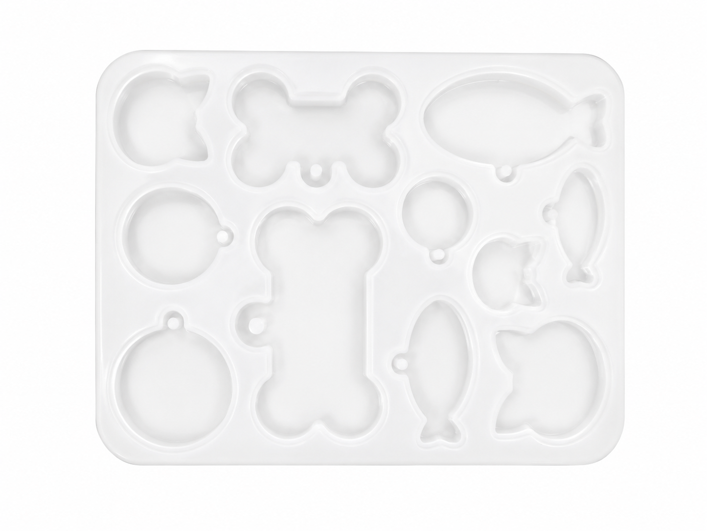 Molde para manualidades con diseños de hueso, pez, globo, manzana y gato en color blanco.