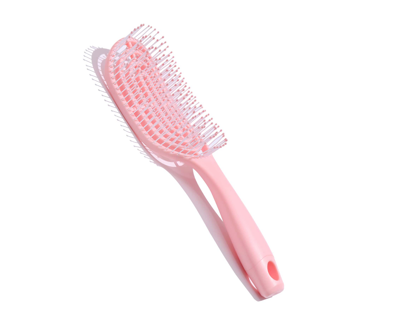 Cepillo de pelo desenredante de color rosa con diseño ventilado y hueco.
