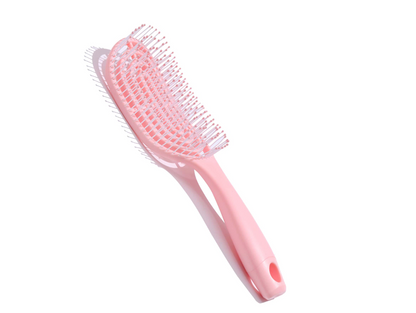 Cepillo de pelo desenredante de color rosa con diseño ventilado y hueco.