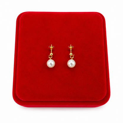 Aretes Colgantes con Perla Sintética Blanca y Acabado Dorado.
