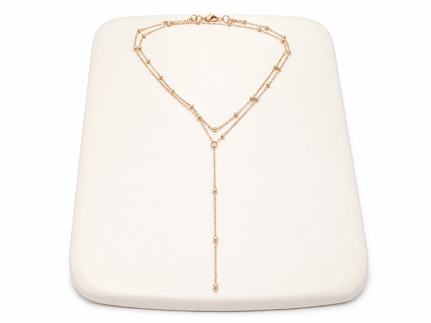 Collar Dorado de Doble Cadena con Detalles de Bolitas y Diseño Largo en Y.