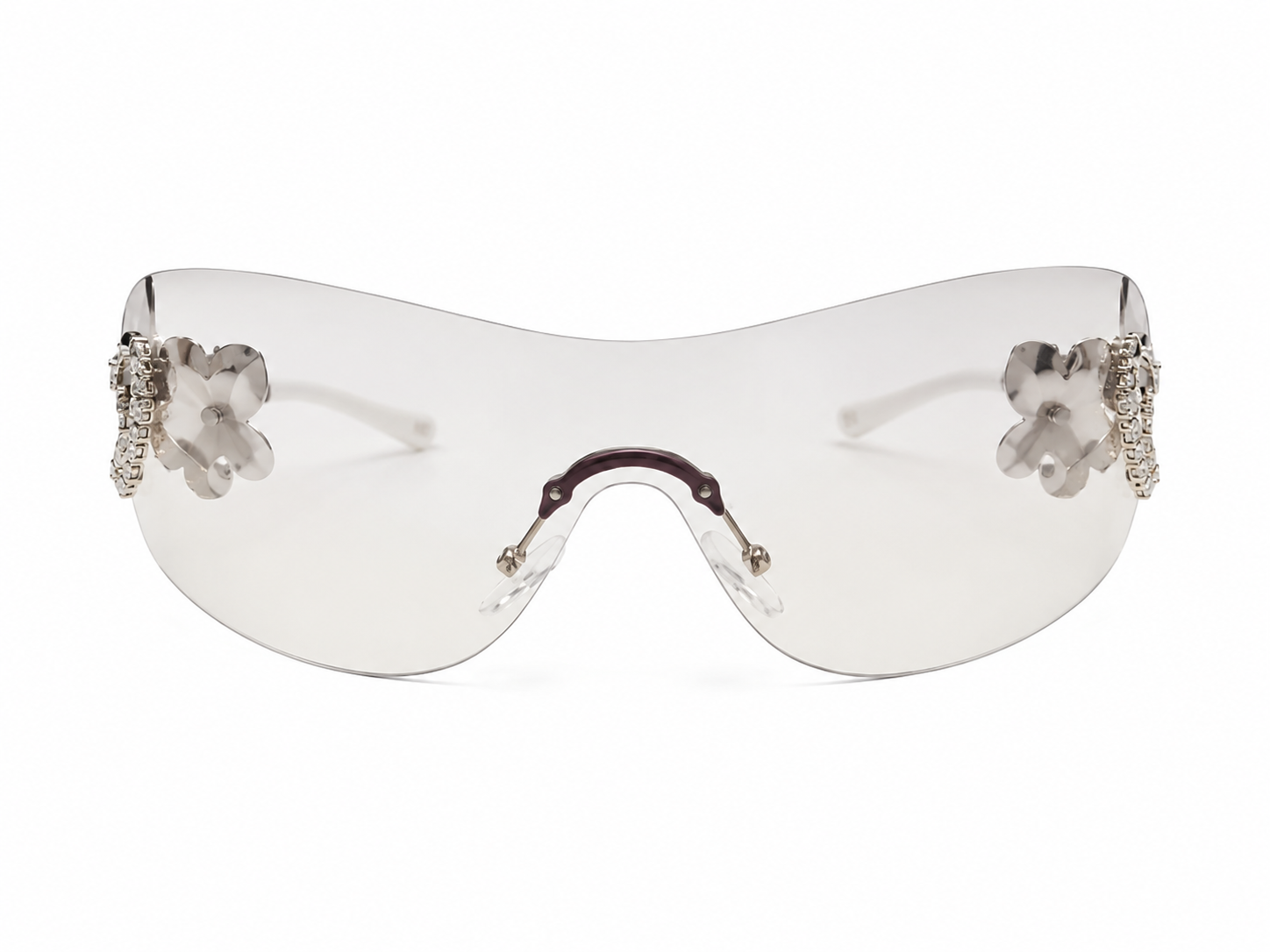 Gafas de sol tipo visor con diseño floral transparente.