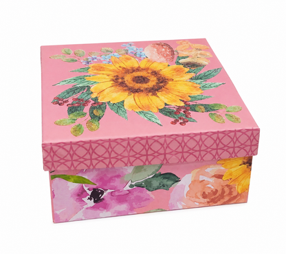 Caja decorativa rosa con diseño floral de girasol y tapa removible.