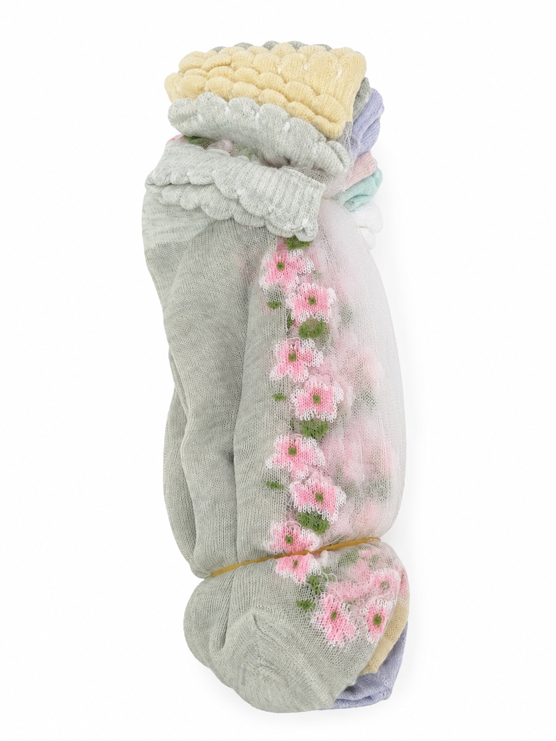 Paquete de calcetines largos para niña con diseño floral y colores pastel.