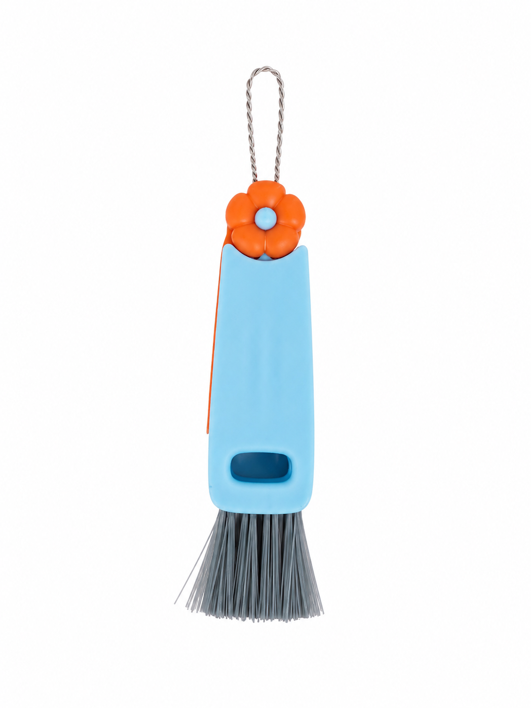 Cepillo limpiador con cerdas suaves, mango azul y detalle de flor naranja.