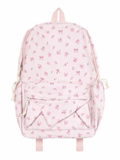 Mochila Rosa con Estampado Floral y Lazos, Bolsillo Frontal y Compartimentos Laterales.