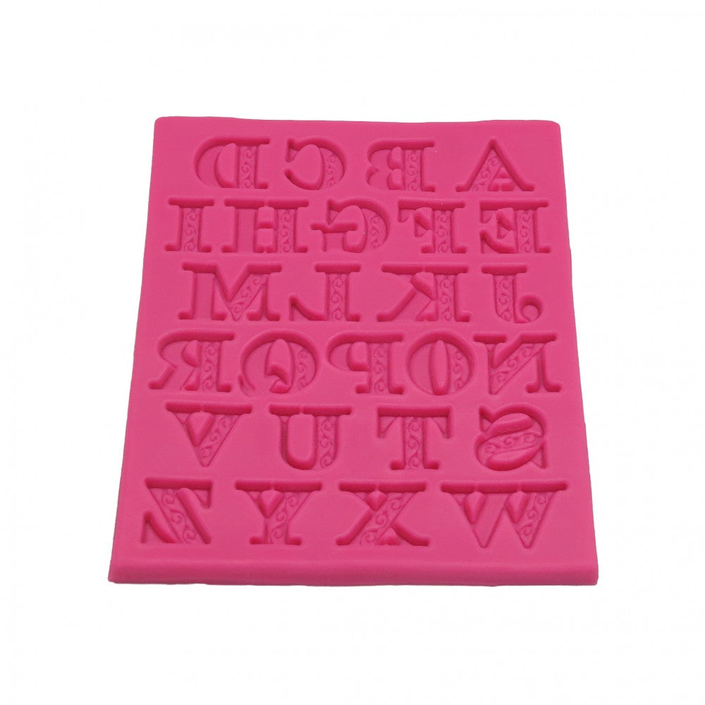 Molde de silicona rosa para hacer letras de chocolate o fondant.