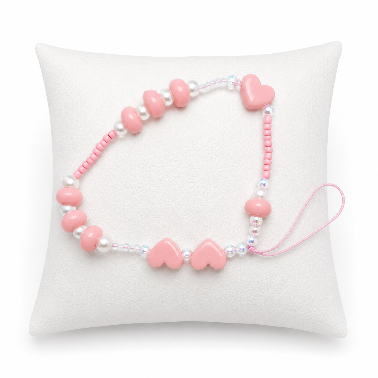 Pulsera Artesanal de Cuentas Rosadas con Corazones Decorativos.