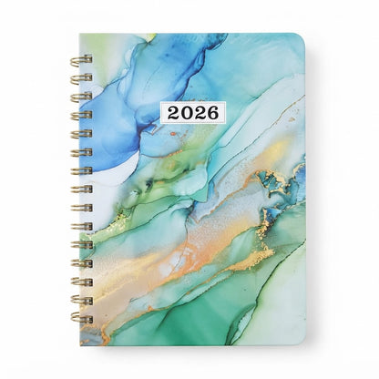 Agenda 2026 presenta con un diseño de cubierta con efecto de tinta al alcohol en tonos azules y verdes.