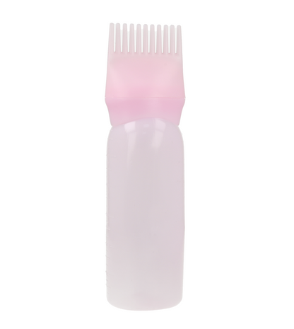 Botella aplicadora de tinte para el cabello color rosa.