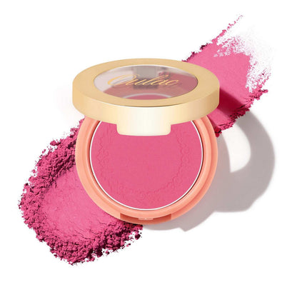 Rubor en polvo en un tono rosado vibrante.